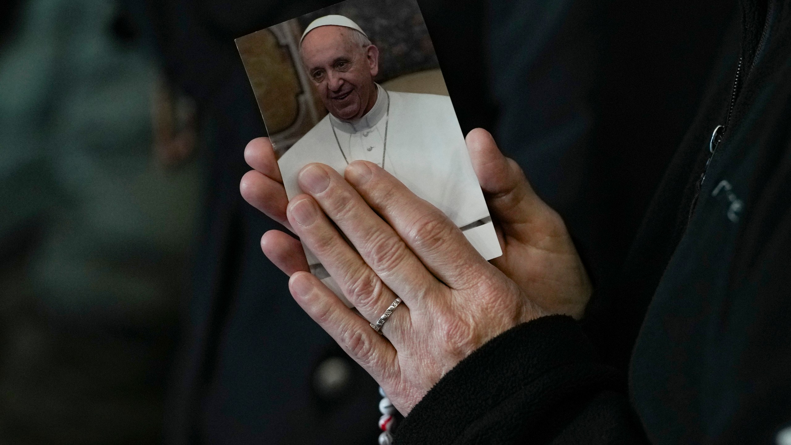 A nun attends a Rosary prayer for Pope Francis, in St. Peter's Square at the Vatican, Monday, March 10, 2025. (AP Photo/Andrew Medichini)