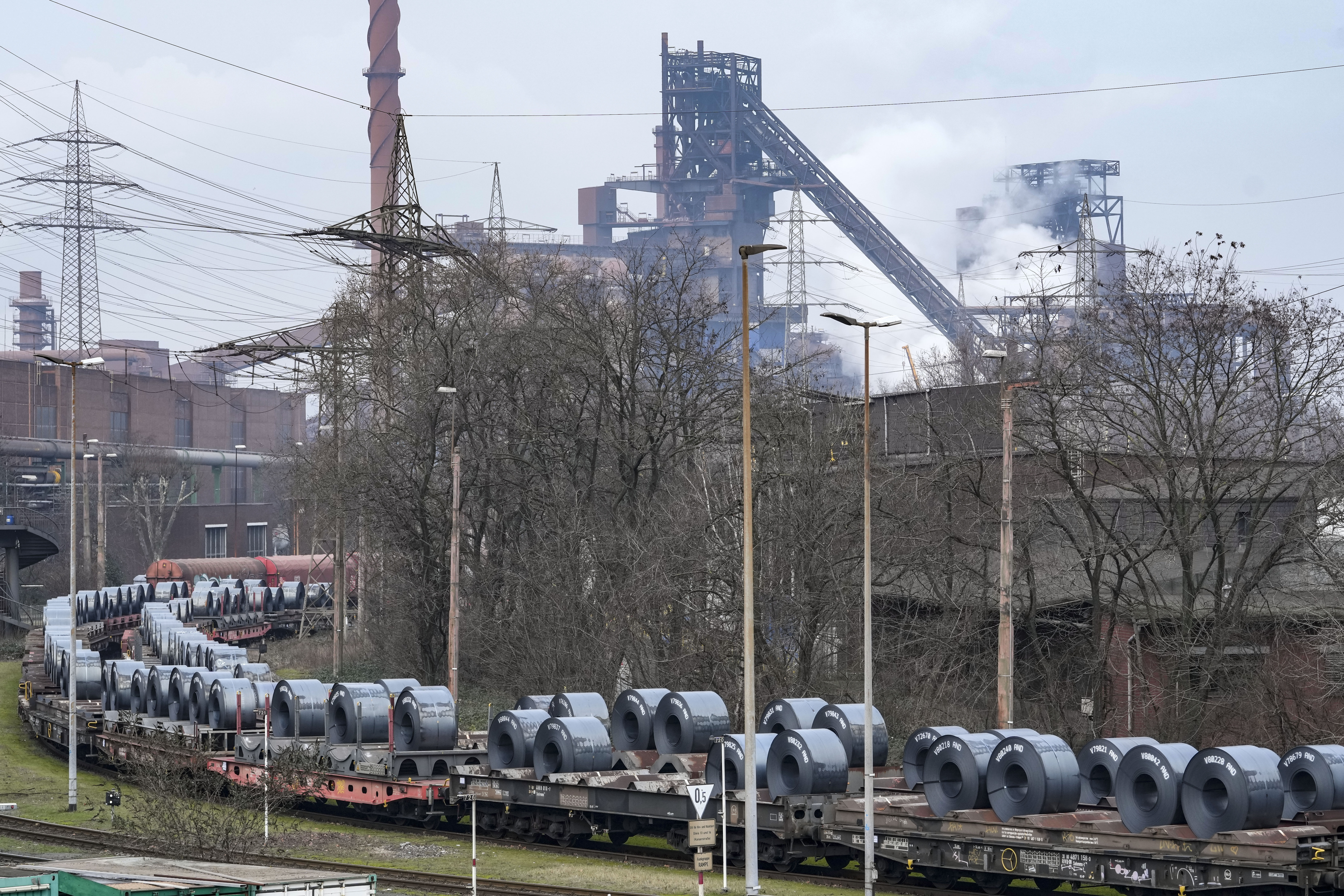 FILE - Steel on coil cars ahead of transport at the main factory of struggling steel producer thyssenkrupp in Duisburg, Germany, Tuesday, Feb. 4, 2025. (AP Photo/Martin Meissner, File)